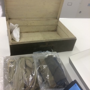 This barracks box from the Aleutian campaign contains clothing that must be addressed.  It may need to be vacuumed, and the arrangement and support of the garments in the box needs to be determined with aesthetics, interpretation, and long term preservation in mind.
